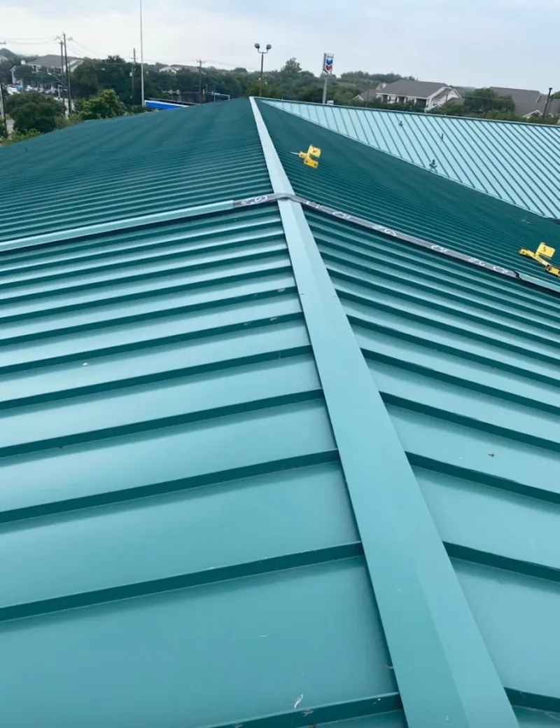 Green commercial metal roof ridge and valley for Metal Roof Repair in Gorham