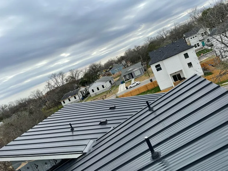 Standing seam metal roof panels with vents for Skylight Repair in Gorham